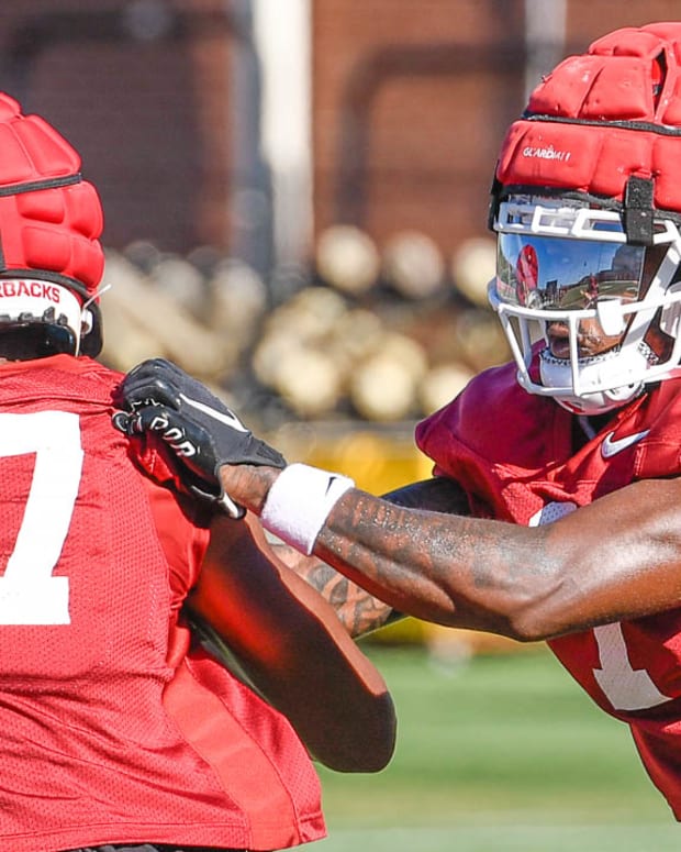 Razorbacks' defensive back Lorando "Snaxx" Johnson during workouts on the turf field on the outdoor practice field.